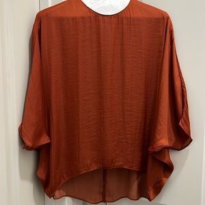 Fabrik silk dolman sleeve blouse. Burnt orange/rust color. Great condition.